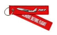 Keyholder with `Remove Before Flight ` on one side and `707' and silhouette on other side