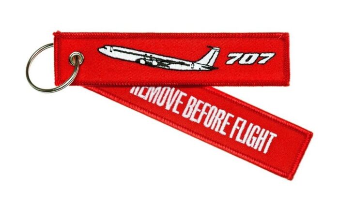 Keyholder with `Remove Before Flight ` on one side and `707' and silhouette on other side