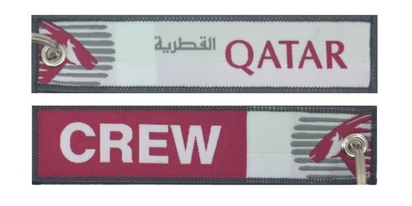 Keyholder with Qatar on one side and Qatar crew on other side